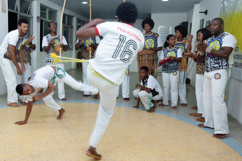 Capoeiristas practise their routines at the local centre run by Tonho Matéria