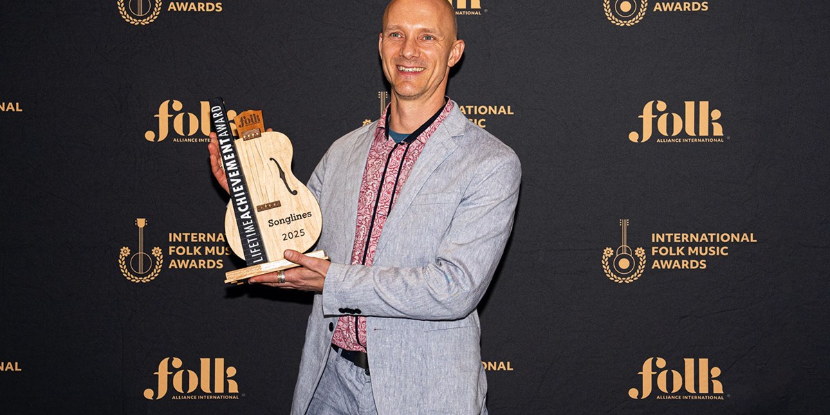 James Anderson Hanney Holds Up The Lifetime Achievement Award